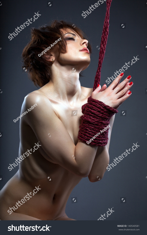 stock-photo-sexual-red-haired-naked-woman-tied-with-rope-140540581