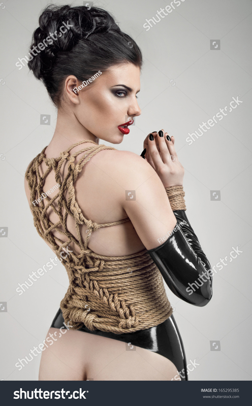 stock-photo-sexy-woman-in-rope-bandage-165295385